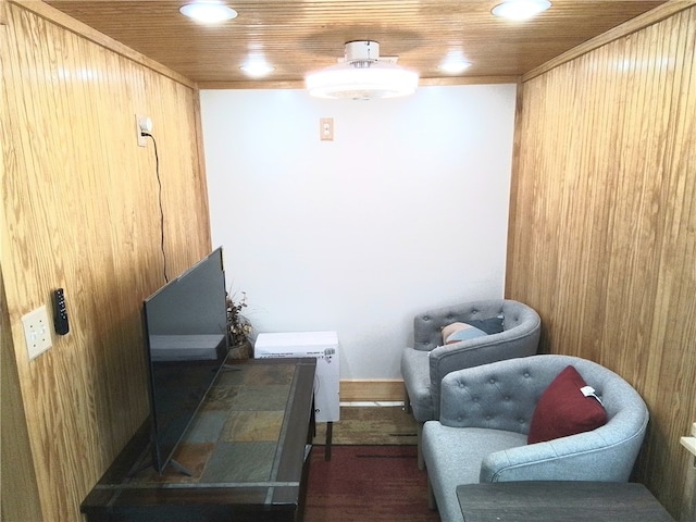 sitting room featuring wood ceiling, dark wood-type flooring, and wooden walls