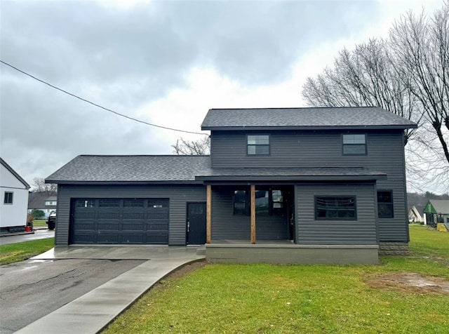 view of front of home with a porch, a garage, and a front yard