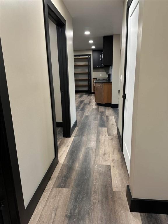 hallway featuring dark wood-type flooring