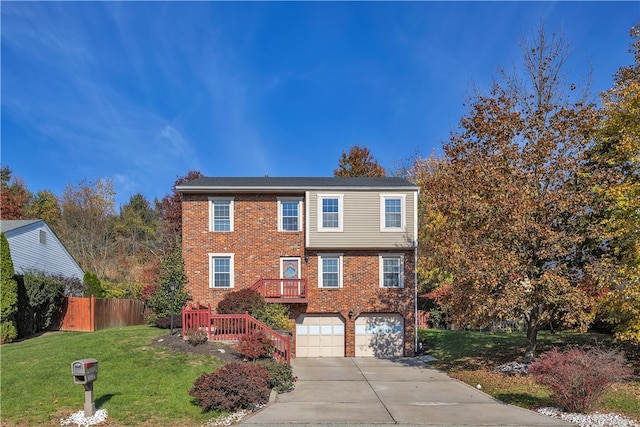 view of front of property with a garage and a front lawn