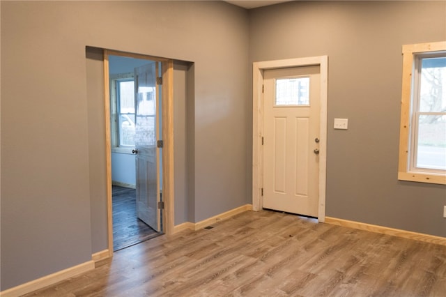 foyer with light hardwood / wood-style flooring