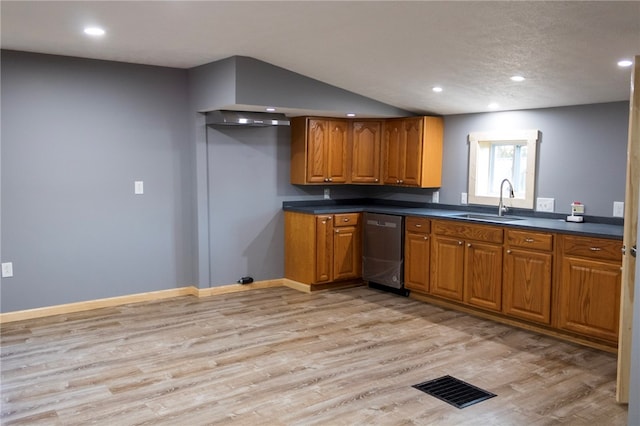 kitchen featuring light hardwood / wood-style flooring, stainless steel dishwasher, and sink