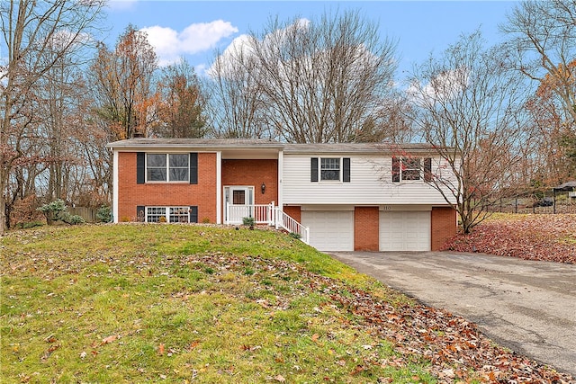 bi-level home with a front lawn and a garage