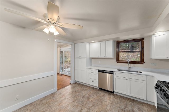 kitchen with dishwasher, white cabinets, black range with gas cooktop, and sink