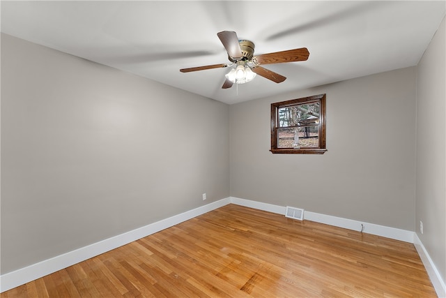 spare room featuring ceiling fan and light hardwood / wood-style floors