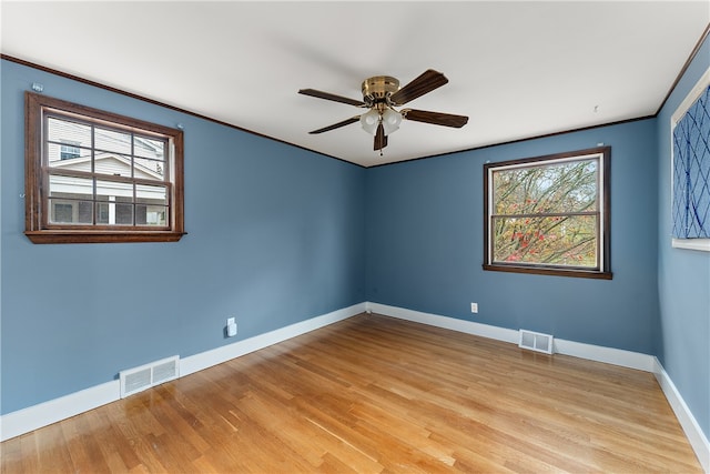 empty room featuring ceiling fan and light hardwood / wood-style flooring