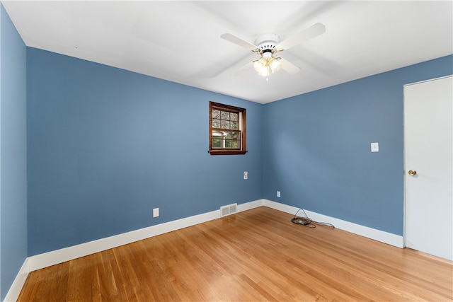 empty room featuring ceiling fan and light wood-type flooring