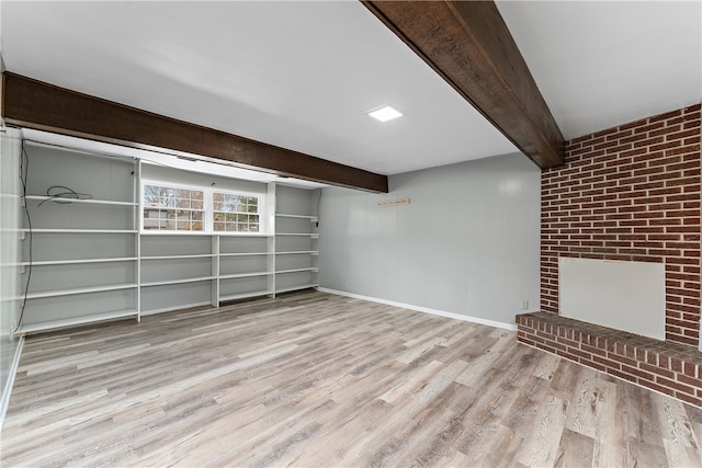 basement featuring light hardwood / wood-style flooring