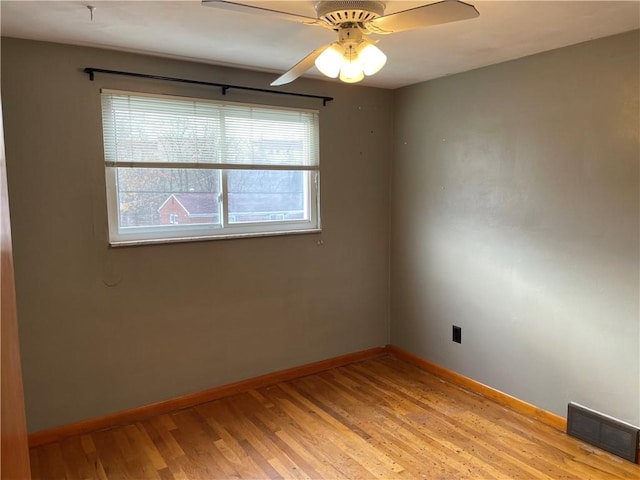 unfurnished room with ceiling fan and light wood-type flooring