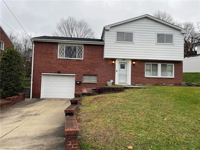 view of front of house with a garage and a front lawn