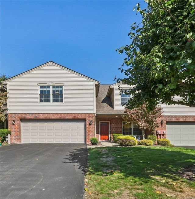 view of front of house featuring a front yard and a garage