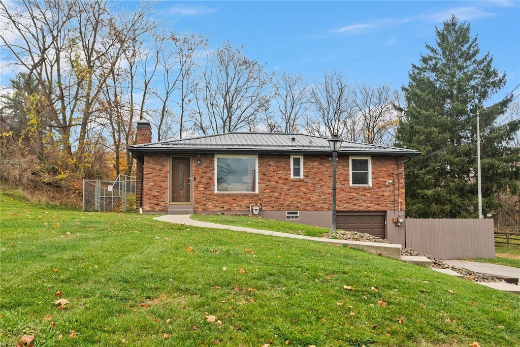 exterior space with a garage and a front yard