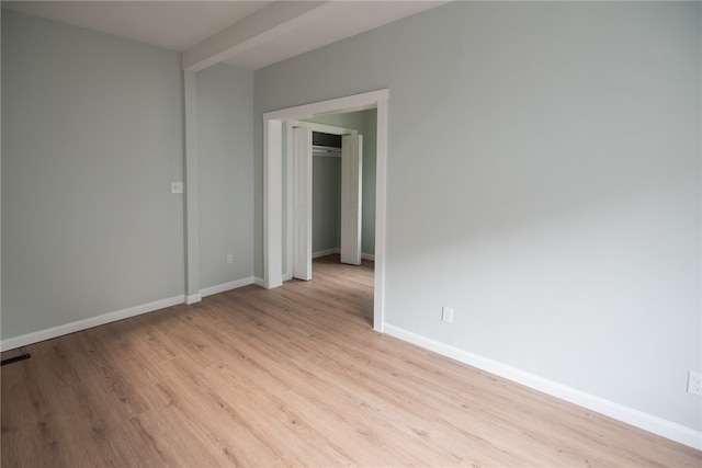 spare room featuring light wood-type flooring