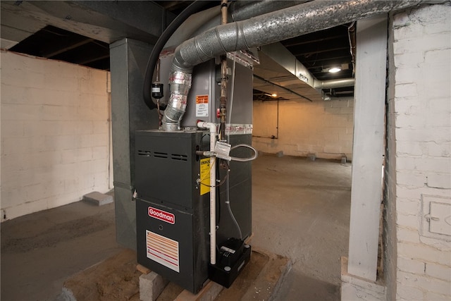 utility room featuring heating unit