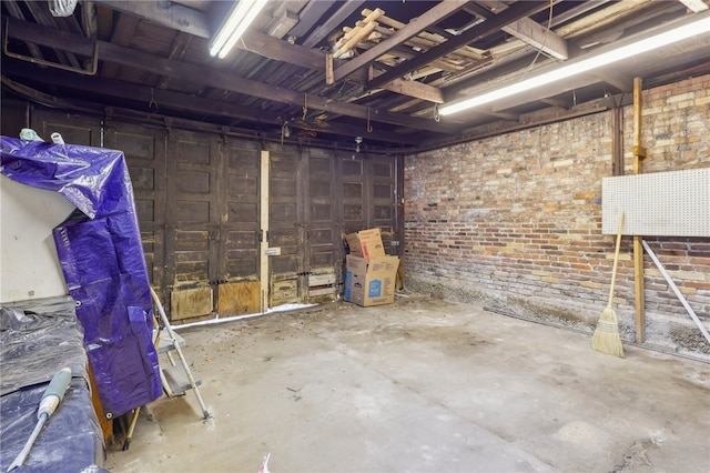 basement with brick wall