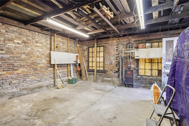 basement with brick wall