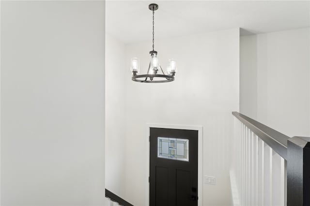 foyer featuring a notable chandelier