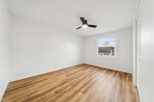 spare room with ceiling fan and light hardwood / wood-style flooring