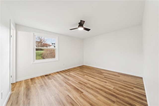 unfurnished room featuring ceiling fan and light hardwood / wood-style flooring