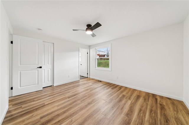 unfurnished bedroom with light hardwood / wood-style flooring and ceiling fan