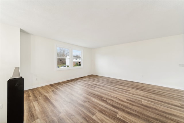 spare room with light wood-type flooring