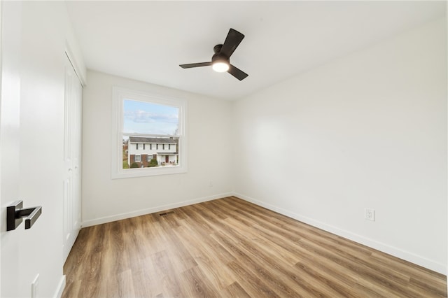 unfurnished room featuring ceiling fan and hardwood / wood-style floors