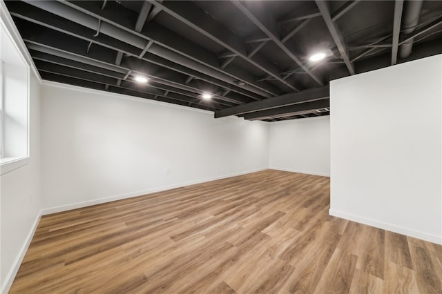 basement featuring hardwood / wood-style flooring