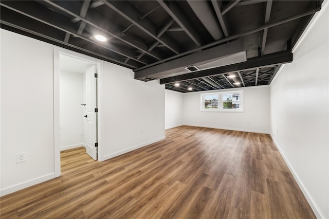 basement featuring hardwood / wood-style floors