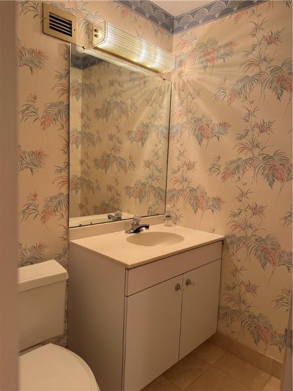 1160 Bower Hill Rd Unit 314A, Mt Lebanon, PA 15243 - bathroom with vanity, tile patterned flooring, toilet, wallpapered walls, and baseboards