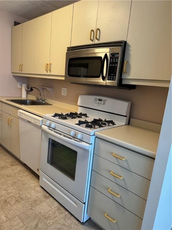 1160 Bower Hill Rd Unit 314A, Mt Lebanon, PA 15243 - kitchen featuring white appliances, a sink, and light countertops