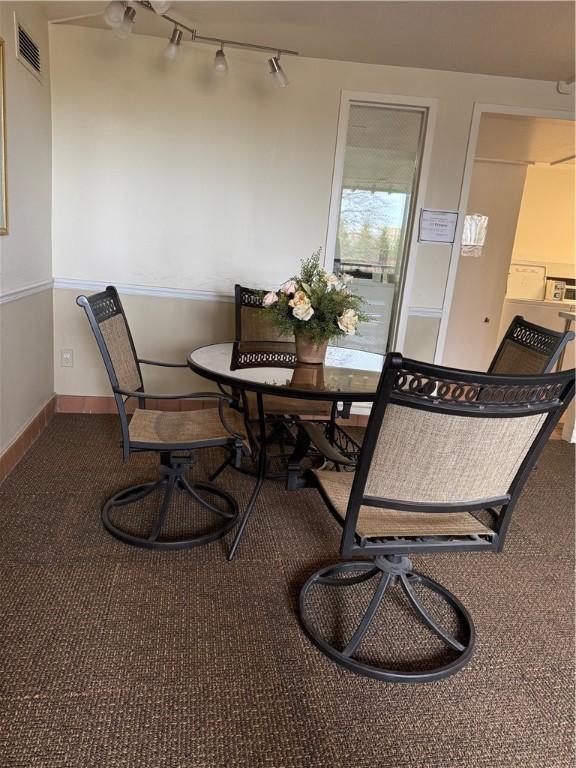 1160 Bower Hill Rd Unit 314A, Mt Lebanon, PA 15243 - dining space with carpet, baseboards, and rail lighting