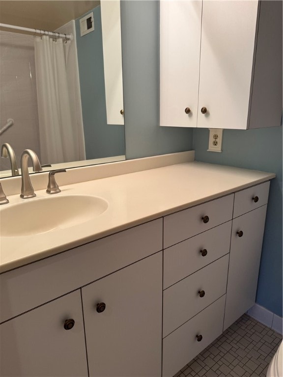 bathroom with tile patterned floors, vanity, and toilet