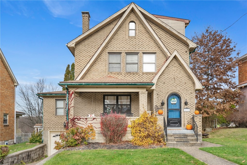 view of front facade with a front yard and a garage