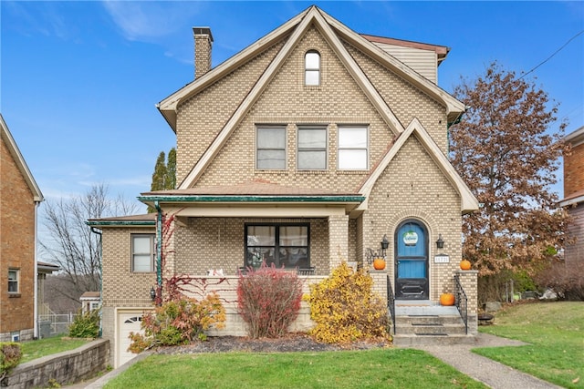 view of front facade with a front yard and a garage