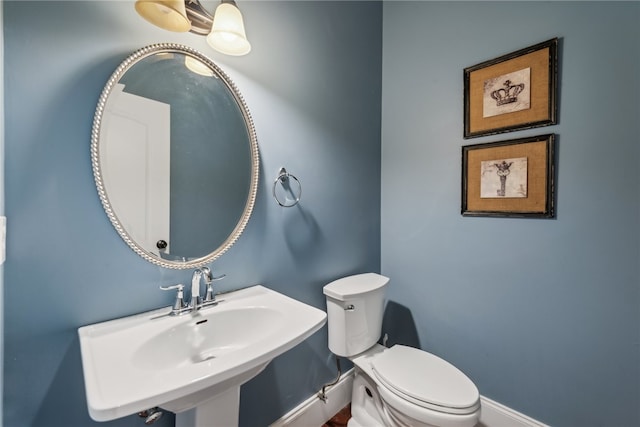 bathroom with toilet and sink