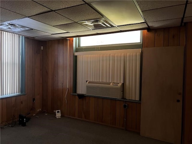 empty room with cooling unit and wooden walls