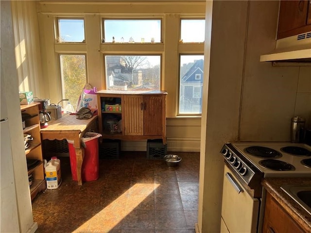 kitchen with a healthy amount of sunlight and white electric range