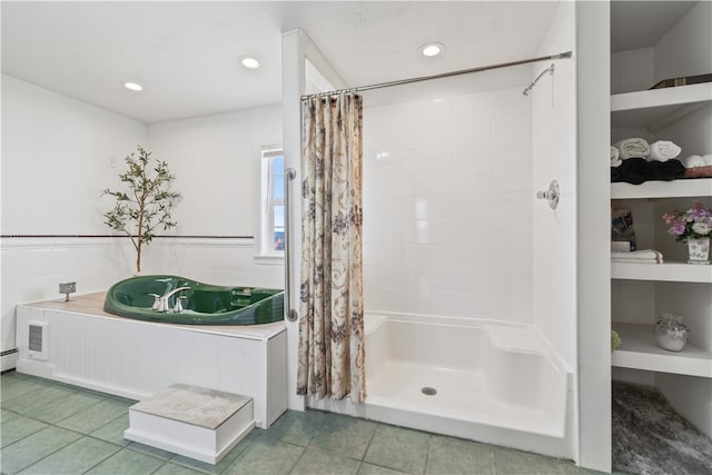 bathroom featuring tile patterned floors and separate shower and tub