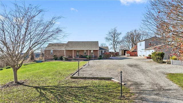 view of front of home featuring a garage and a front lawn