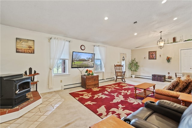 living room with baseboard heating, a wood stove, and lofted ceiling