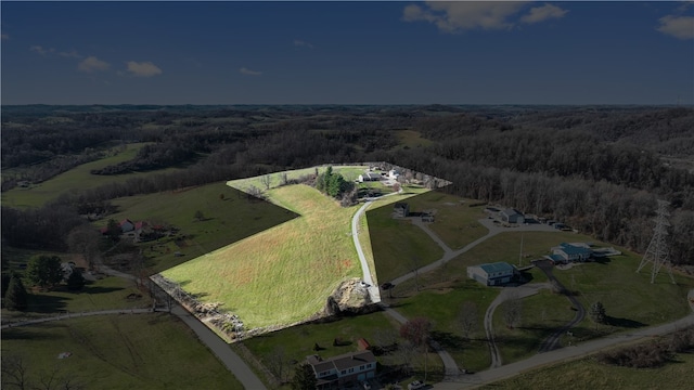 birds eye view of property featuring a rural view