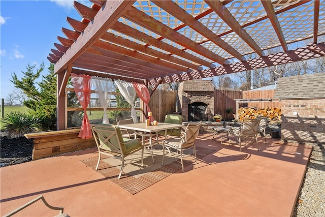 view of patio featuring a pergola and an outdoor fireplace