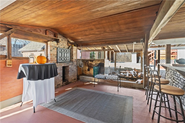 view of patio with a bar and an outdoor kitchen