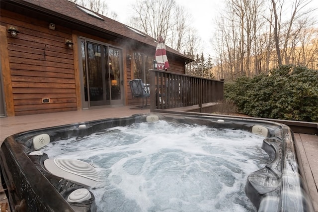 deck with a hot tub