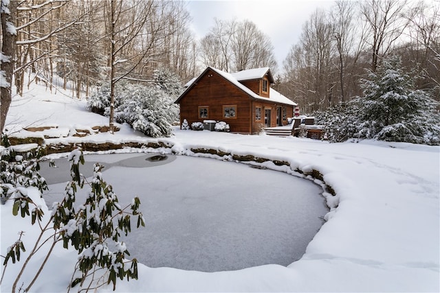 view of yard layered in snow