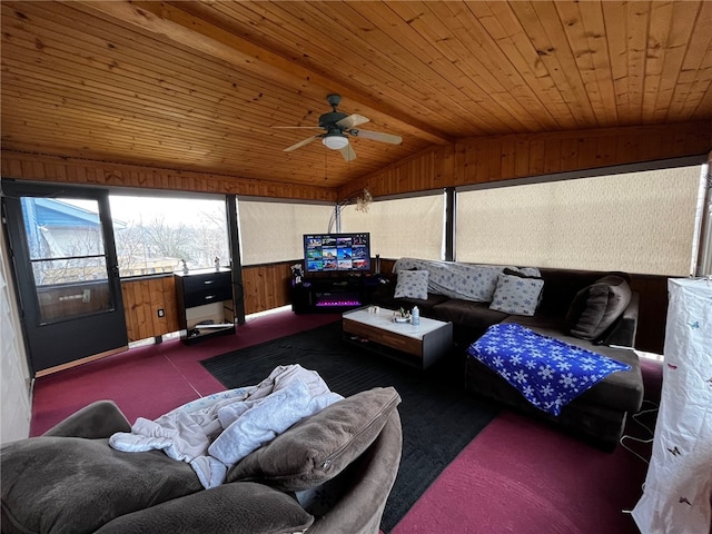 living room with wood walls, dark carpet, vaulted ceiling, ceiling fan, and wood ceiling