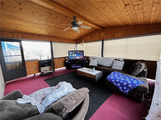 living room featuring wood walls, dark colored carpet, vaulted ceiling, ceiling fan, and wood ceiling