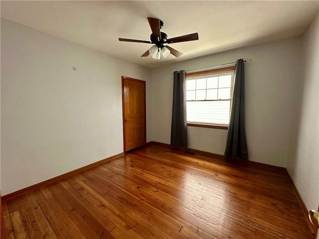 unfurnished room featuring hardwood / wood-style flooring and ceiling fan