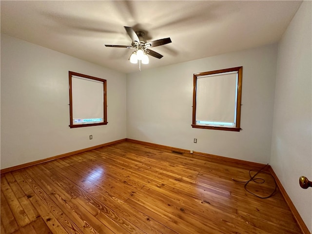 spare room featuring ceiling fan and light wood-type flooring