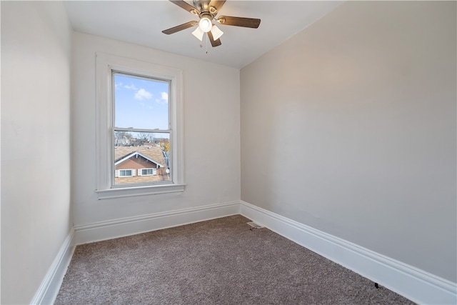 unfurnished room featuring ceiling fan and carpet floors